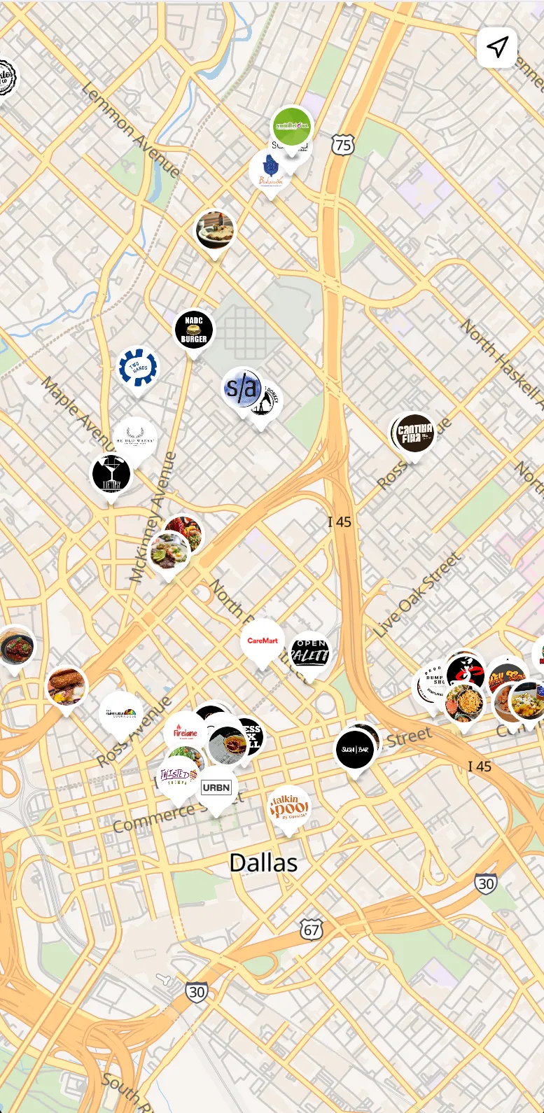 Map view centered on Dallas with merchant logo pins across downtown and a recenter button in the top right